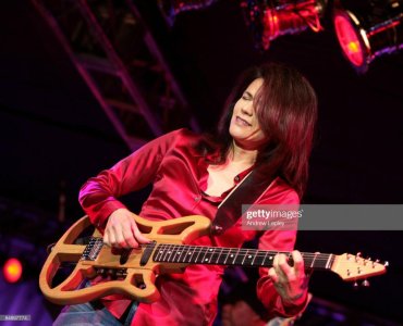 Joyce Cooling Playing Travel Guitar #2.jpg